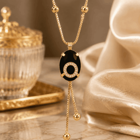 Gold-Tone Black Oval Pendant Necklace with Crystal Halo